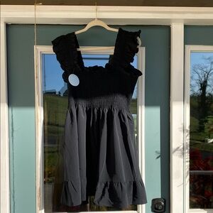 The Hill House black  Ruffled Smocked Mini Dress